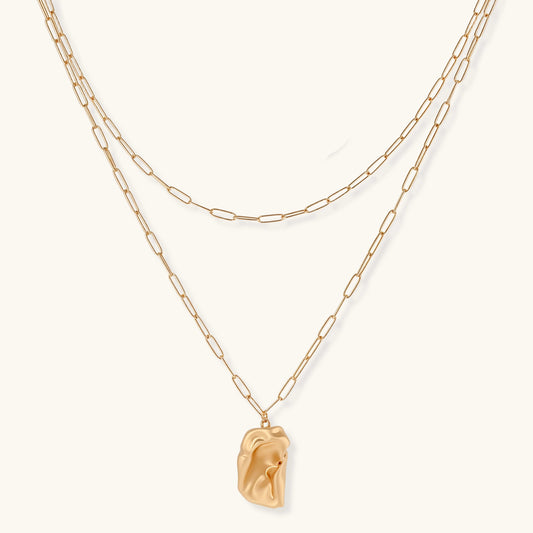 Layered paperclip chain necklace with organic flowing pendant made from eco-zinc alloy in warm gold finish