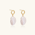 18K gold vermeil twisted circle studs with organic white baroque pearl drops on cream background